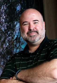Matt Swift portrait in front of video art installation