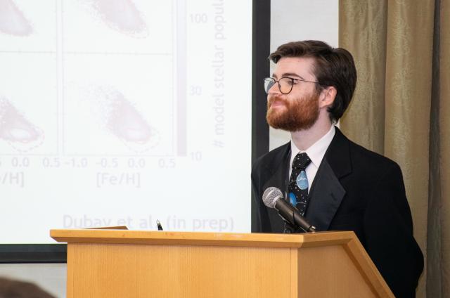 Graduate student giving oral presentation