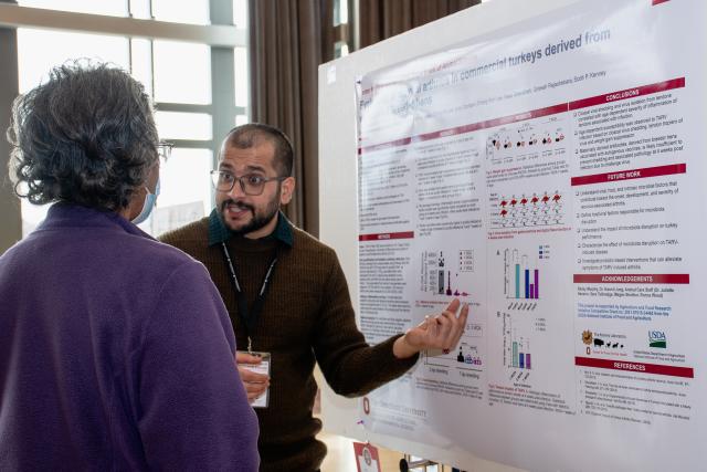 Graduate student and faculty member around student’s research 